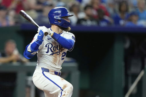 Kansas City Royals' Kyle Isbel watches his three-run double during the sixth inning of a baseball game against the Atlanta Braves