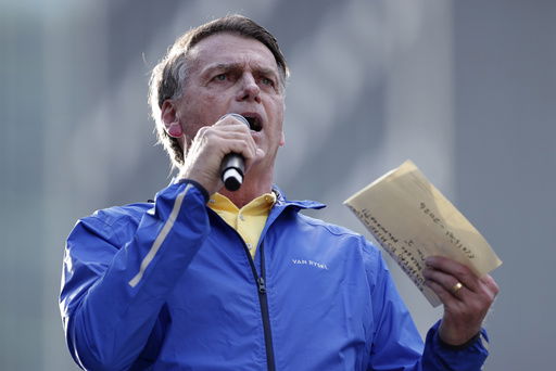 Former President Jair Bolsonaro speaks during a protest against his Supreme Court trial