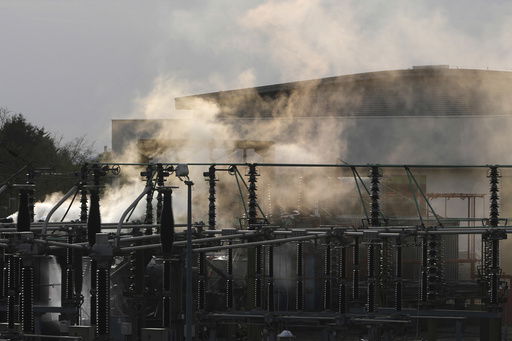 FILE -Smoke rises from the North Hyde electrical substation
