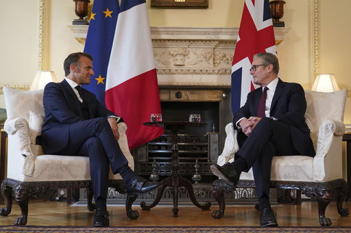 Britain's Prime Minister Keir Starmer and French President Emmanuel Macron sit down for bilateral talks at 10 Downing Street in London