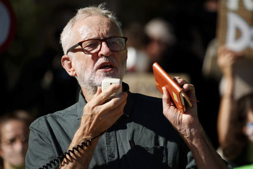 FILE - Former British Labour Party leader Jeremy Corbyn addresses activists at a 'climate strike' demonstration
