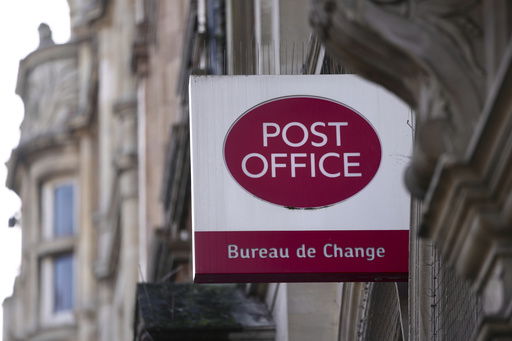 FILE - A logo of a post office is displayed in London