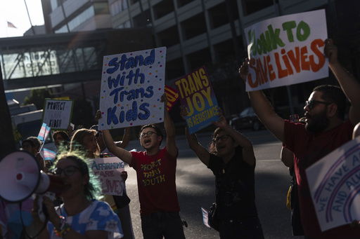 Protesters chant slogans while demonstrating against the closure of the trans youth clinic at Children's Hospital Los Angeles
