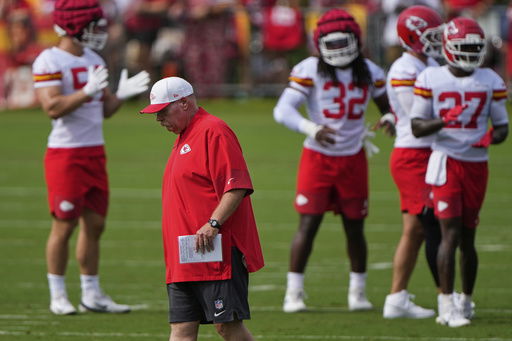 Kansas City Chiefs head coach Andy Reid walks between drills at NFL football training camp Tuesday