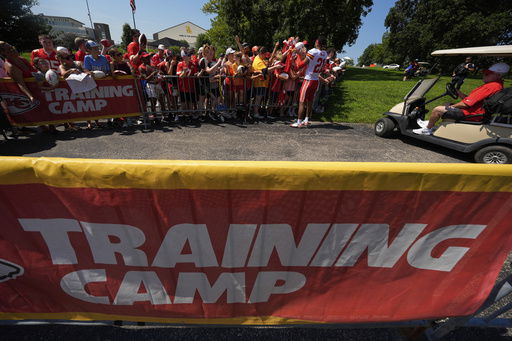 Kansas City Chiefs safety Jaden Hicks signs autographs during Back Together Weekend at the team's NFL football training camp