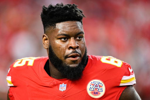 FILE - Kansas City Chiefs guard Trey Smith comes off the field after warmups before an NFL football game against the New Orleans Saints