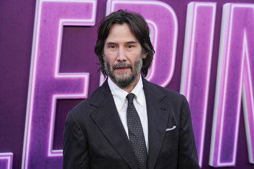 FILE - Keanu Reeves arrives at the premiere of