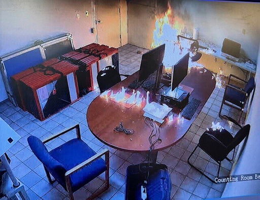 This surveillance image provided by the Archuleta County Clerk & Recorder shows a fire inside a room in the Archuleta County Clerk Recorder's office in Pagosa Springs