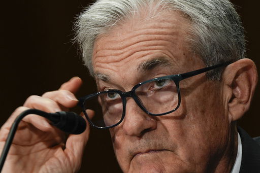 FILE - Federal Reserve Board Chairman Jerome Powell listens during a Senate Committee on Banking hearing