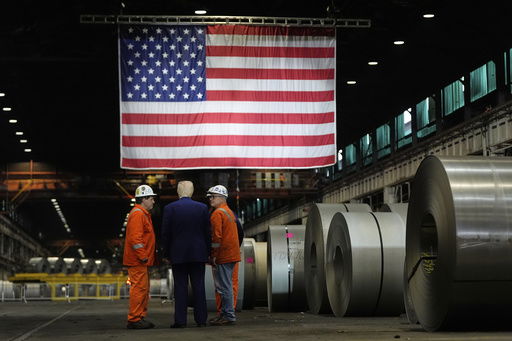 FILE - President Donald Trump talks to workers as he tours U.S. Steel Corporation's Mon Valley Works-Irvin plant