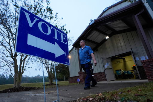 FILE - A voter leaves a polling location after voting Tuesday