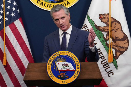 FILE - Calif. Gov. Gavin Newsom presents his revised 2025-2026 state budget during a news conference in Sacramento