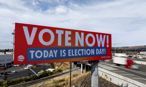 FILE - A billboard urges drivers to vote on Election Day in Union City