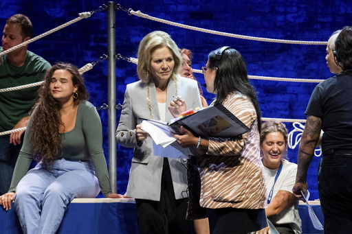 This image released by Aspen Opera Theater shows co-director Renée Fleming during a rehearsal with the cast of Mozart’s Così fan tutte at the historic Wheeler Opera House in Aspen