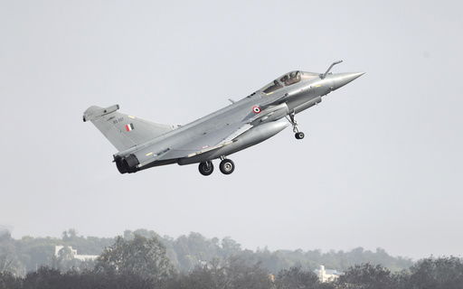 FILE - A French-made Rafale fighter jet takes off on the inaugural day of the Aero India 2021 at Yelahanka air base in Bengaluru
