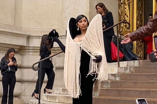 Cardi B holds a crow at Schiaparelli's Fall-Winter 2025/26 Haute Couture show in Paris