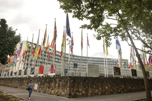 A woman walks by the UNESCO headquarters Tuesday