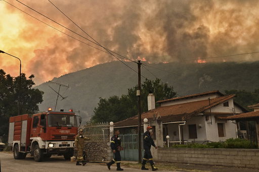 A major forest fire burns in the village of Karteri