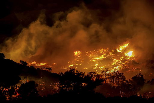 Fire burns in the Ahlia area near the port town of Ierapetra on the south coast of Crete island
