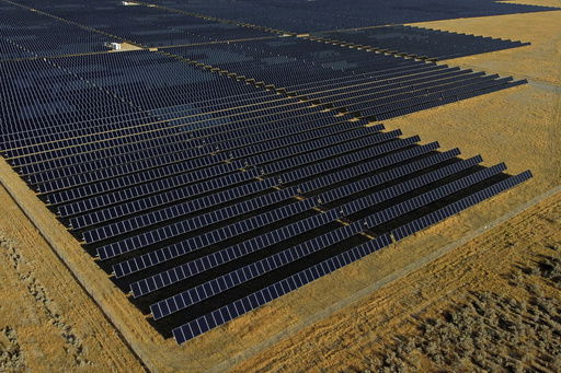 FILE - A solar farm sits in Mona