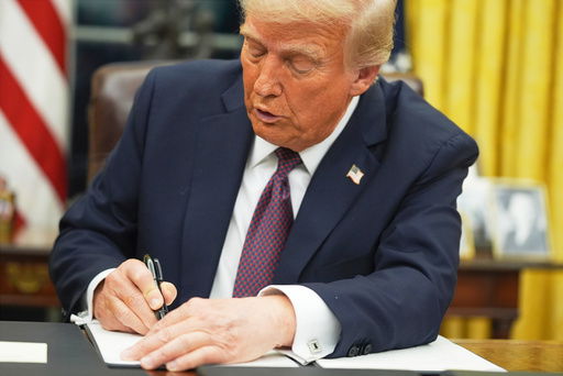 FILE - President Donald Trump signs an executive order on birthright citizenship in the Oval Office of the White House in Washington