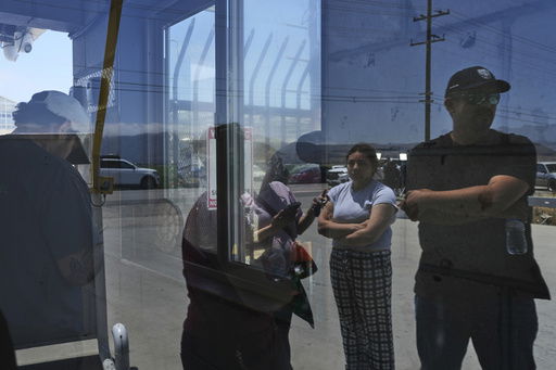 People wait outside of Glass House Farms