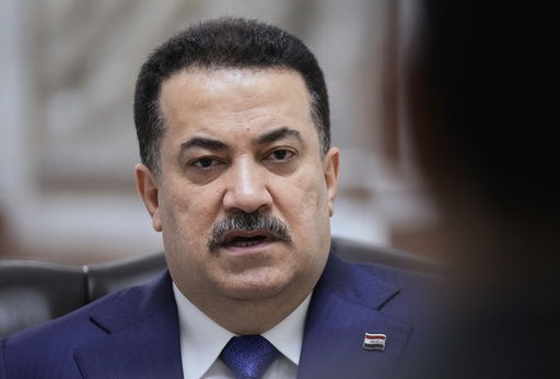 Iraq's Prime Minister Mohammed al-Sudani speaks during an interview with The Associated Press in Baghdad on Monday