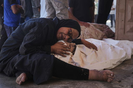 Khaleda El-Feki embraces the body of her husband