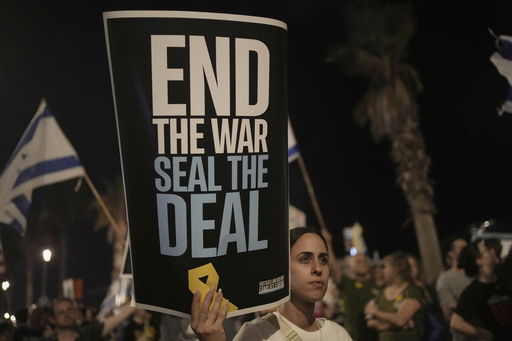 People take part in a protest outside US Embassy Branch demanding the end of the war and immediate release of hostages held by Hamas in the Gaza Strip