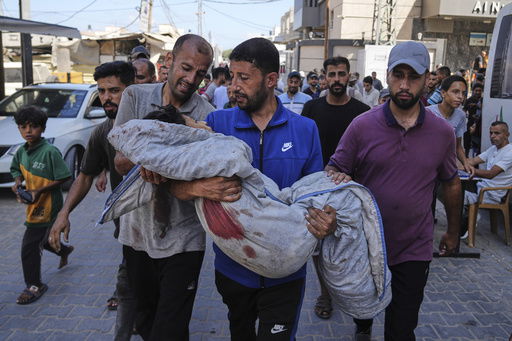 Relatives carry the body of 13-year-old Seraje Ebrahim