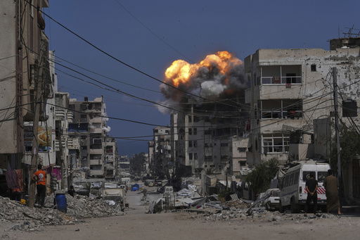 Smoke and flames erupt from an Israeli airstrike in Gaza City