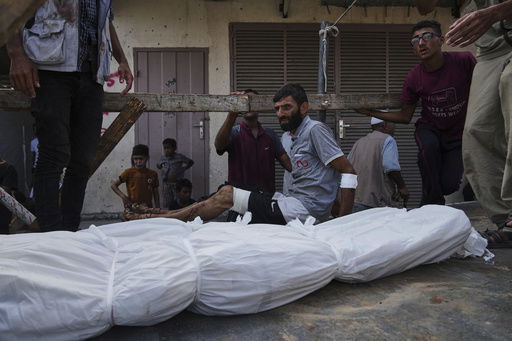 Mourners attend the funeral of their relatives killed in an Israeli bombardment