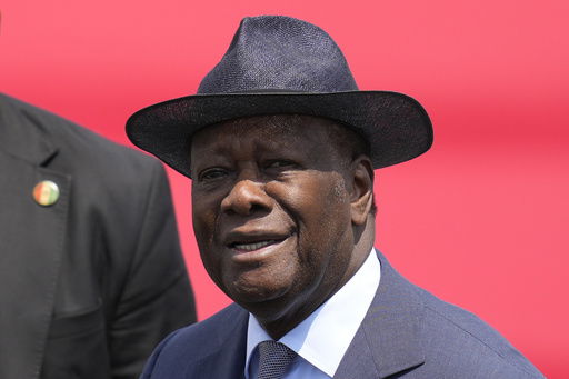 FILE - Ivory Coast's President Alassane Ouattara arrives at the Seoul airport in Seongnam