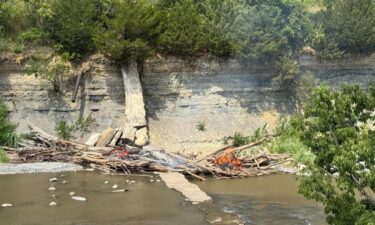 The Salina Fire Department is warning residents that they could face arson charges if attempting to remove a massive log jam by fire on the Smoky Hill River after a nearby fire over the weeken
