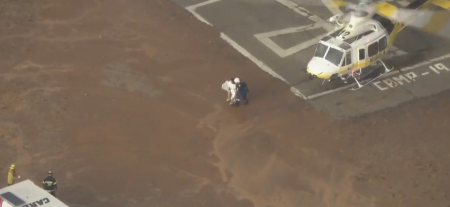 <i>KCAL KCBS via CNN Newsource</i><br/>Firefighters rescued five people after a flash flood in the San Gabriel Mountains swept them away.