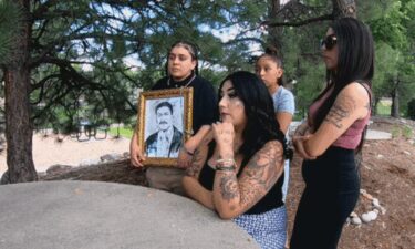 The family of Baldomero Noa-Castaneda holds up a portrait of the 67-year-old father of five while talking about his decades in Colorado and his arrest by ICE early June.