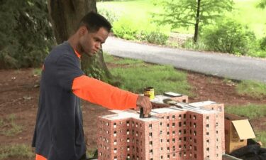 Kambel Smith works on a replica of the Marcy Houses