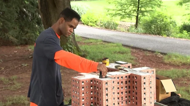 <i>KYW via CNN Newsource</i><br/>Kambel Smith works on a replica of the Marcy Houses
