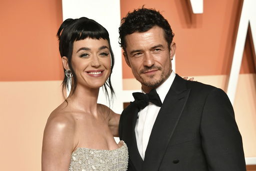 FILE - Katy Perry and Orlando Bloom appear at the Vanity Fair Oscar Party in Beverly Hills