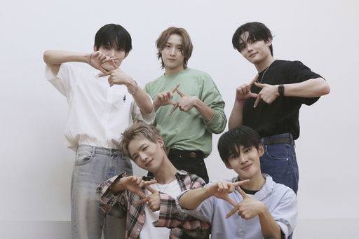 K-pop band 1VERSE members pose for photo at the dance practice room at their label in Seoul
