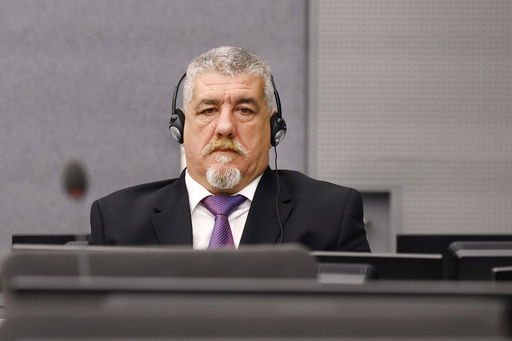FILE - Former Kosovo Liberation Army (KLA) member Pjeter Shala attends his trial as judges at the Kosovo Specialist Chambers will hand down a judgment in The Hague