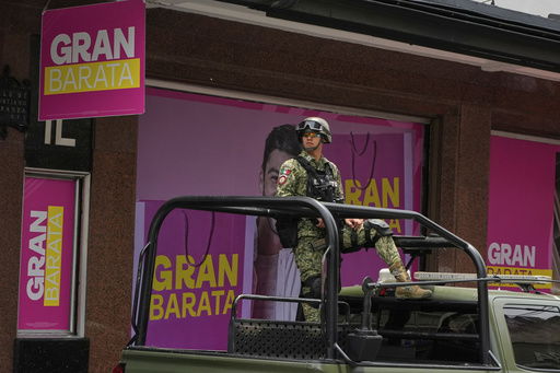 A soldier patrols a street in downtown Mexico City