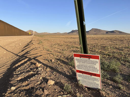 A sign warns against unauthorized entry into a militarized zone along the southern U.S. border in New Mexico on June 12