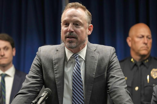 Acting U.S. Attorney Joseph H. Thompson speaks during a news conference at the United States Courthouse in Minneapolis