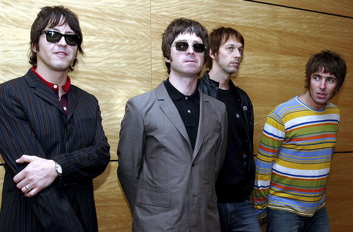 FILE - Members of British rock band Oasis pose for photos ahead of a concert in Hong Kong