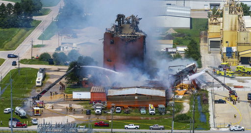 Firefighters battle a fire after an explosion in an industrial area in Fremont