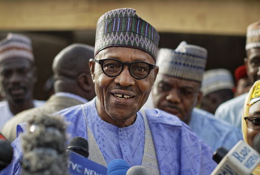 FILE - Nigeria's President Muhammadu Buhari speaks to the media after casting his vote in his hometown of Daura