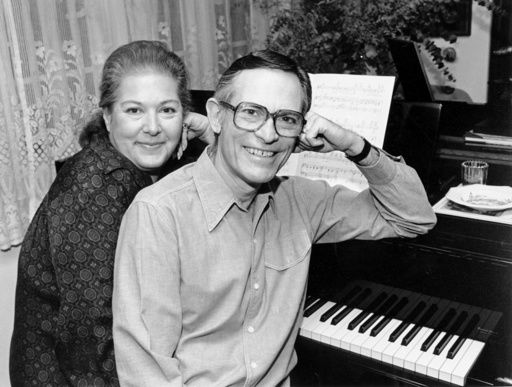FILE - Marilyn and Alan Bergman pose at their piano in their Beverly Hills home on March 17