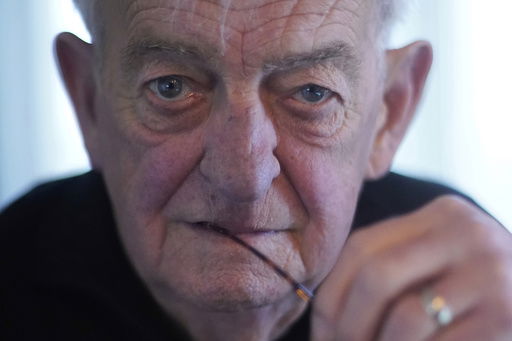 Bob Daughtery sits for a portrait at his home in Noblesville