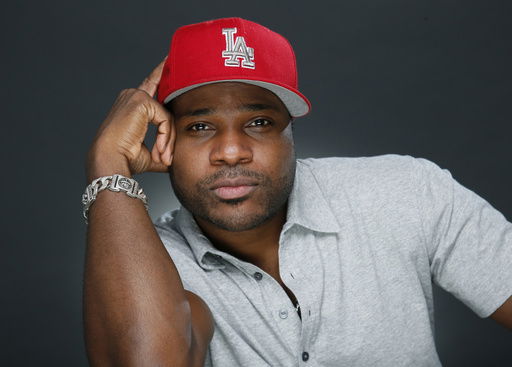 FILE - Actor and musician Malcolm-Jamal Warner poses for a portrait in Los Angeles